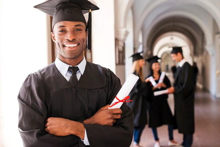 college graduate holding his diploma | Hanania Subaru of Orange Park in Jacksonville FL
