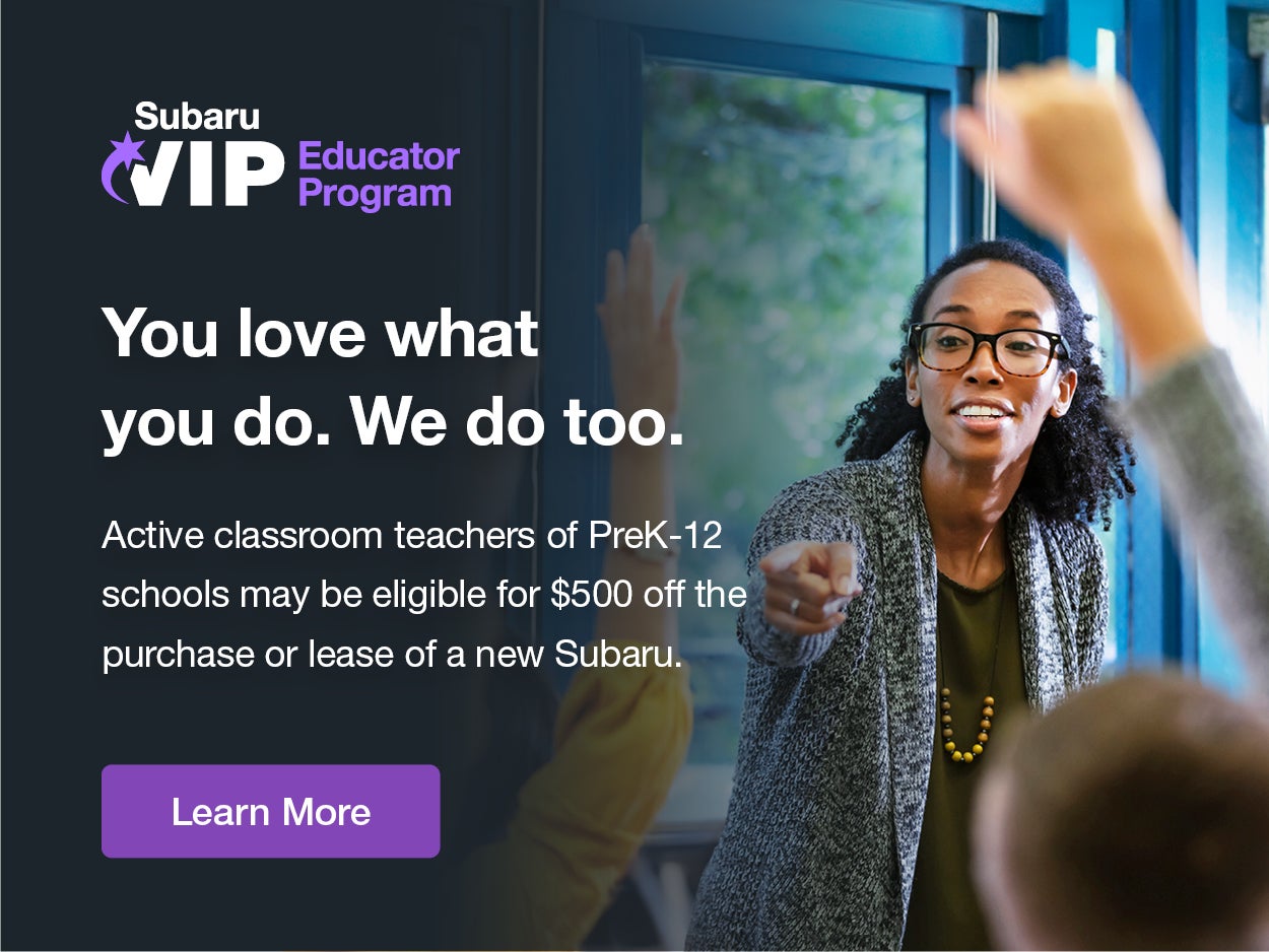 Educator standing in a classroom.