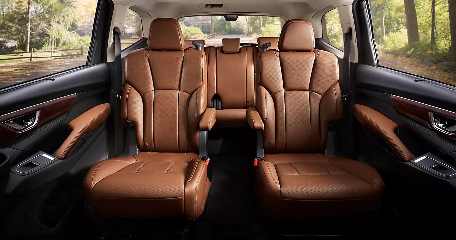 2nd row captains chairs and third row with beige leather interior in a subaru ascent