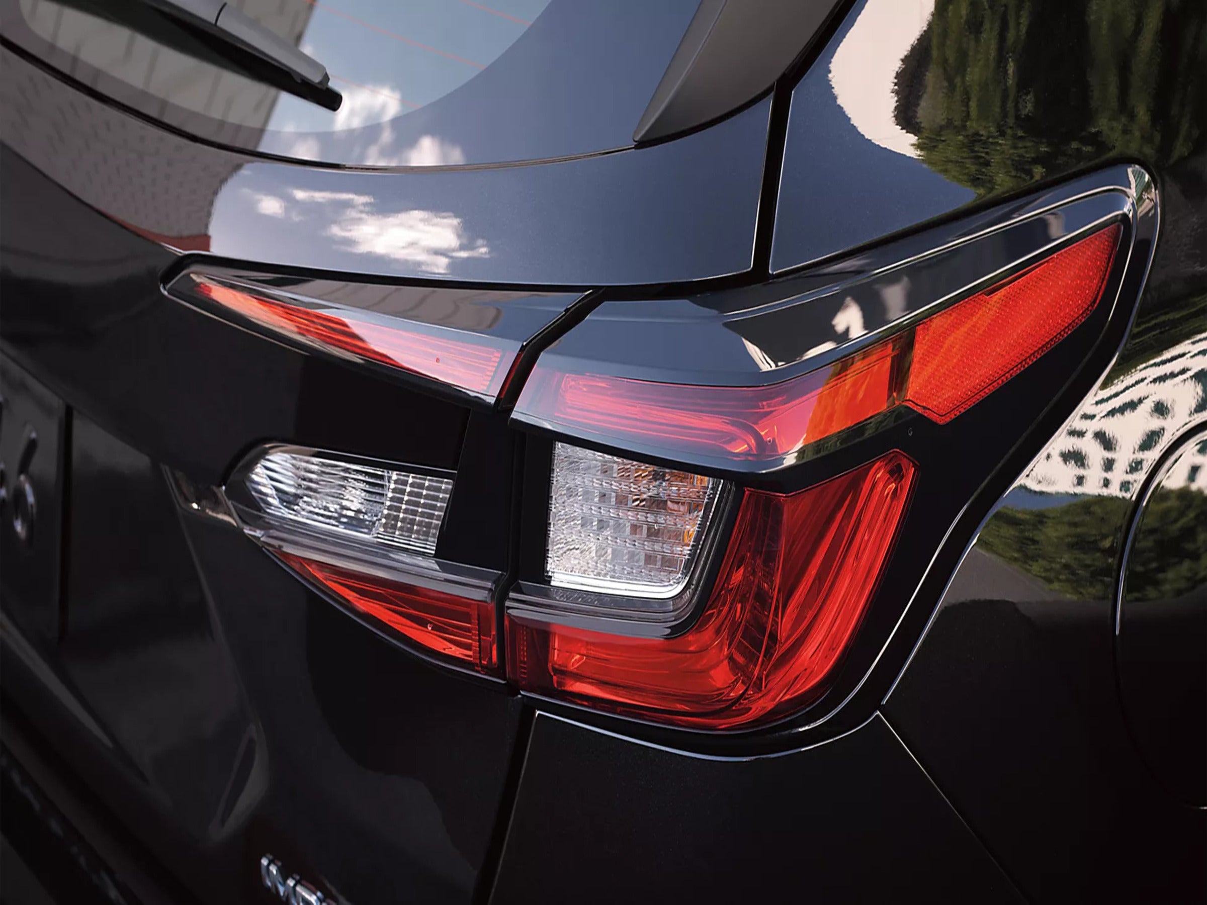 A close look at a black impreza.