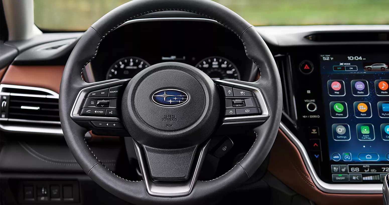 the steering wheel, digital cluster display and part of the infotainment display of a 2025 subaru outback.