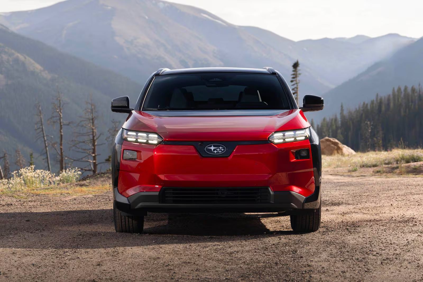 A red car sitting parked.