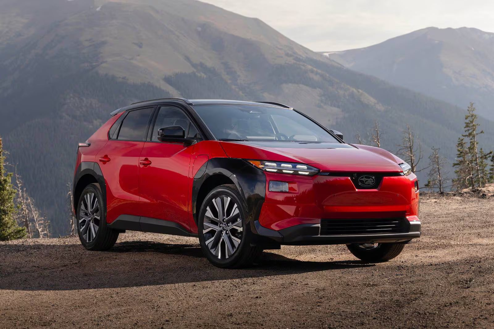 A red car sitting parked.