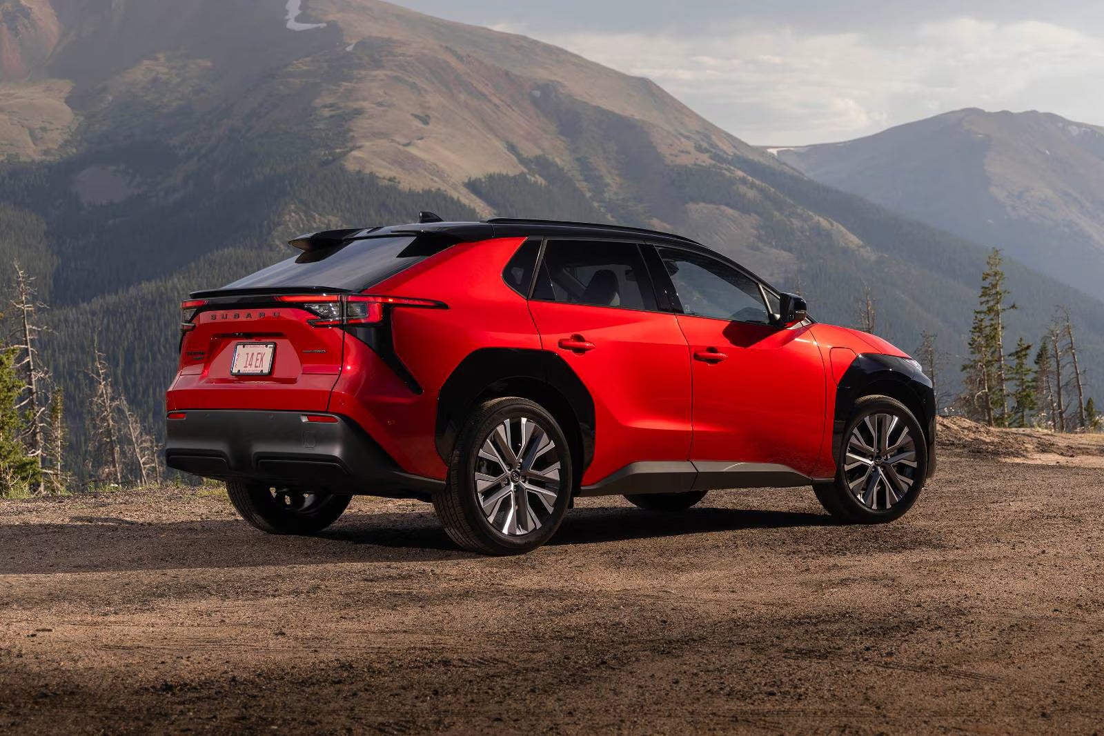 A red car sitting parked.