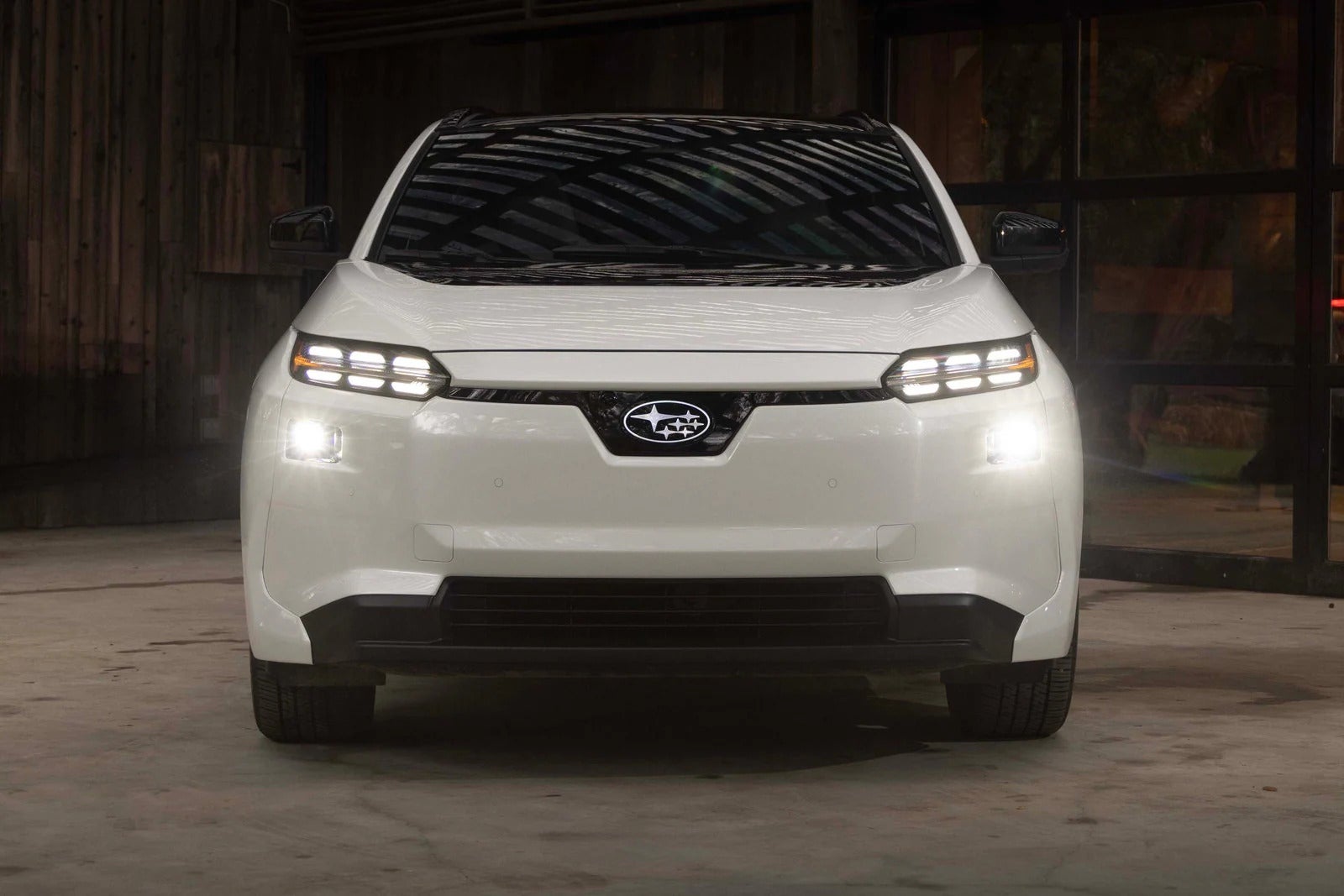 A white car sitting parked inside.