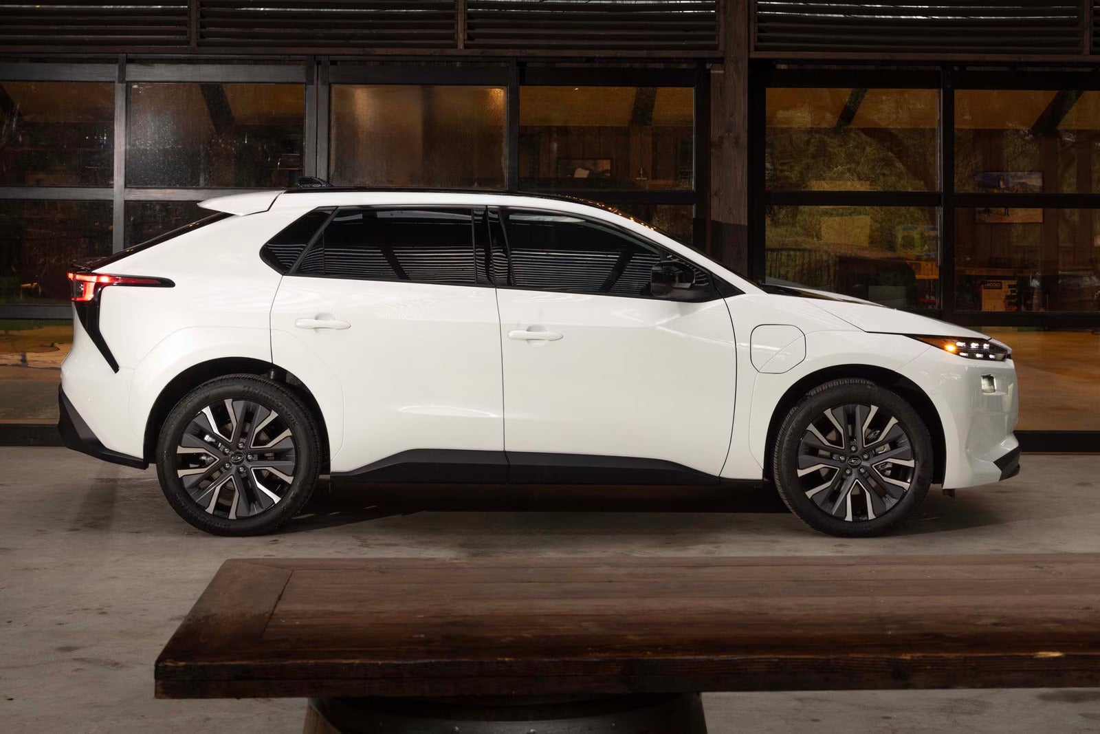 A white car sitting parked inside.