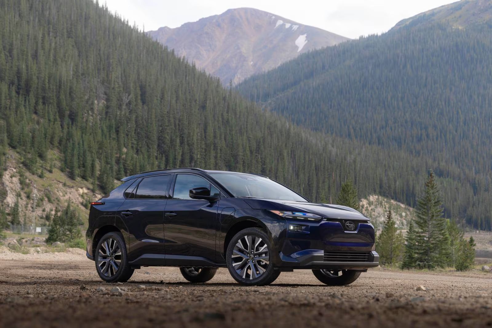 A blue car sitting parked.